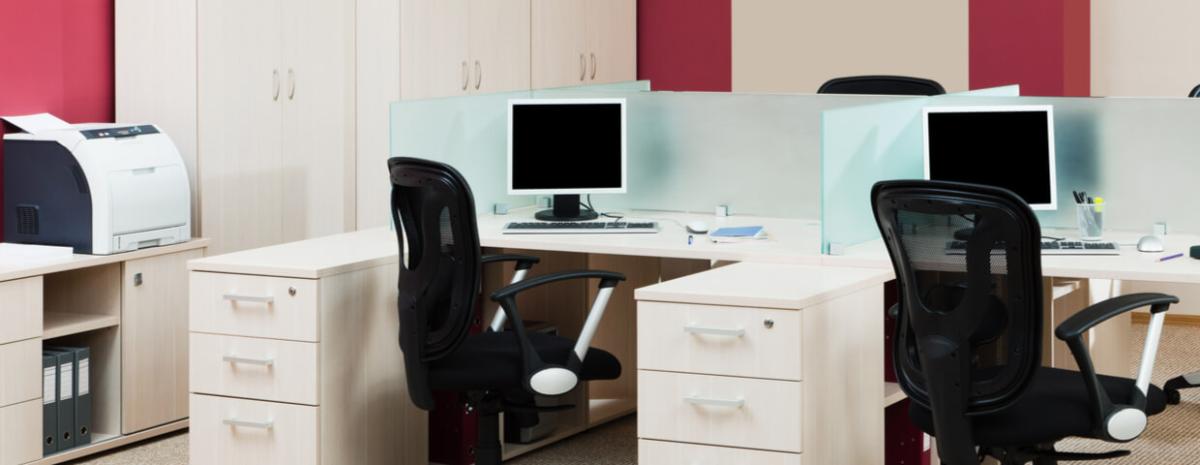 modern office with robust desktop printer right next to a small group of desks, multifunction printer fleet