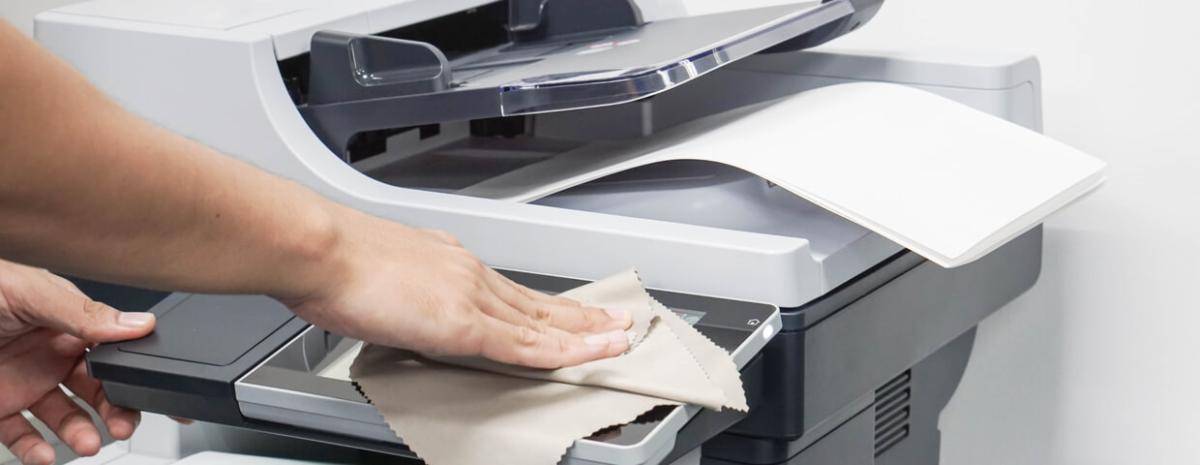 hand wiping or cleaning the touchscreen of a printer
