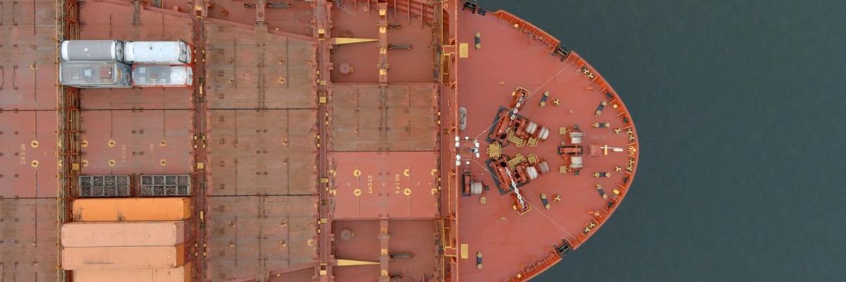 Aerial view of the bow of an empty cargo ship at sea